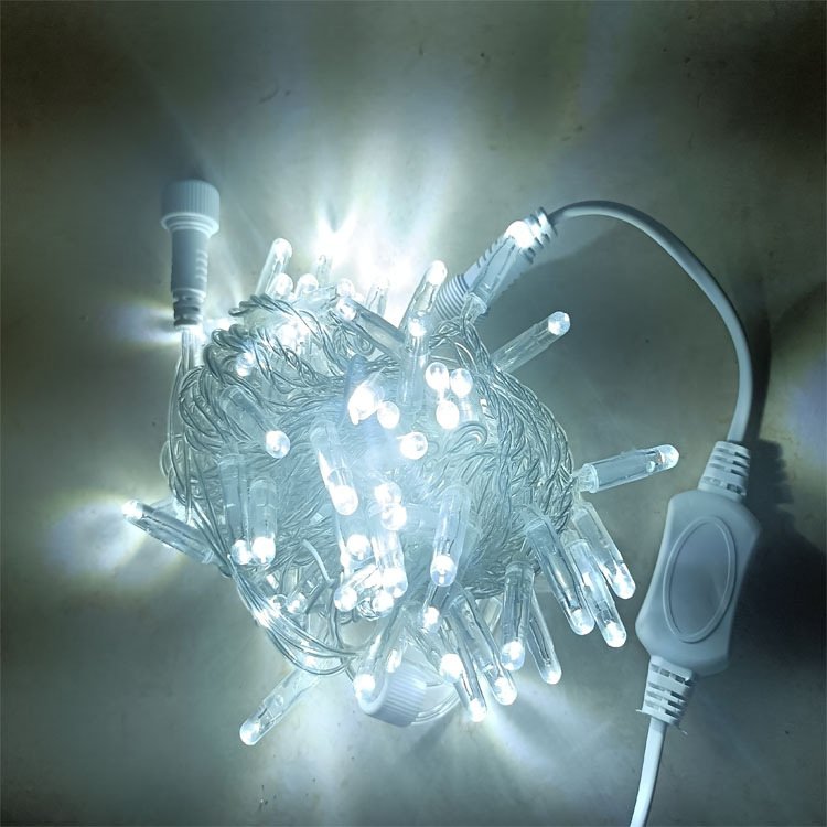 White LED string lights with a coiled cable and connection lead