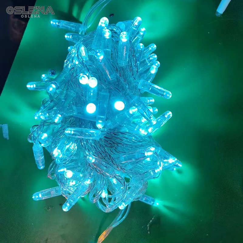 Ice blue IP65 LED string lights illuminated against a teal background
