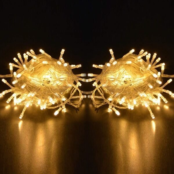 Two coils of warm white IP65 LED string lights displayed on a dark background