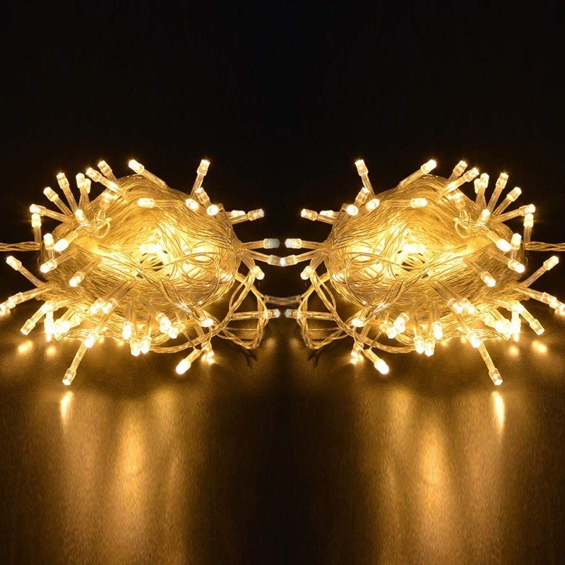Two coils of warm white IP65 LED string lights displayed on a dark background