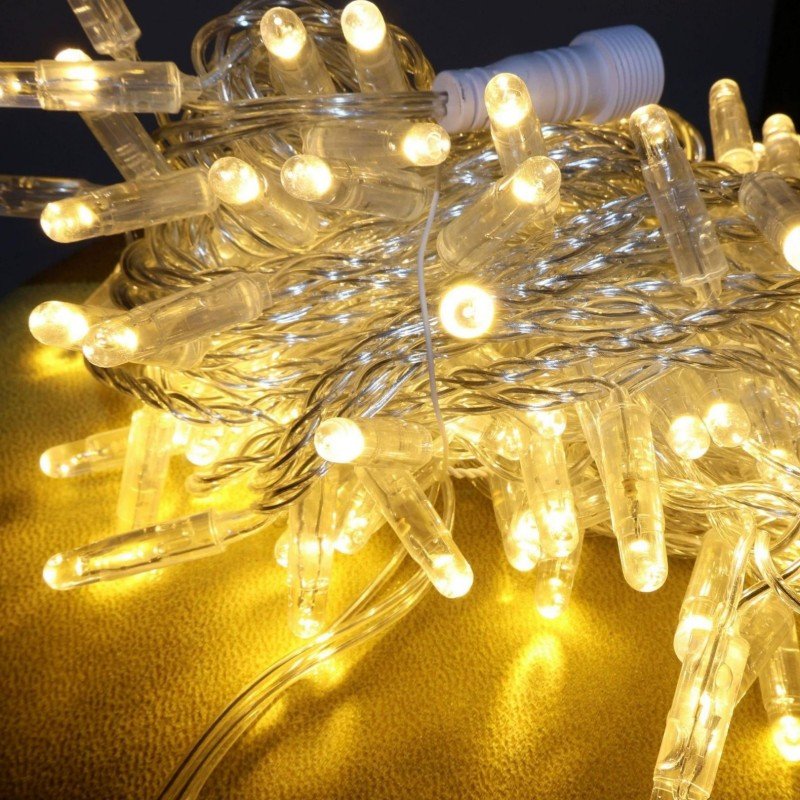 Warm white IP65 LED string lights with clear cable and visible power connector