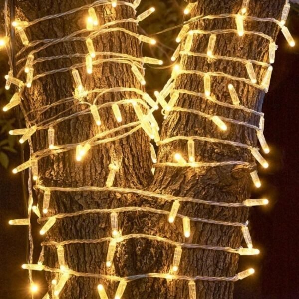 Warm white IP65 LED string lights closely wrapped around outdoor tree trunks