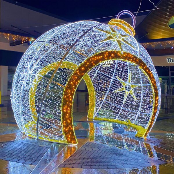 Oversized white holiday sphere with a contrasting warm illuminated arch