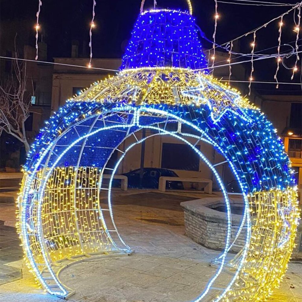 Blue illuminated ornament gateway with a contrasting horizontal ribbon and arched doorway