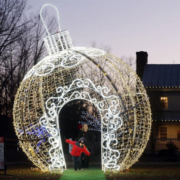 Giant Christmas bauble light with an arched walk-through opening and ornament cap