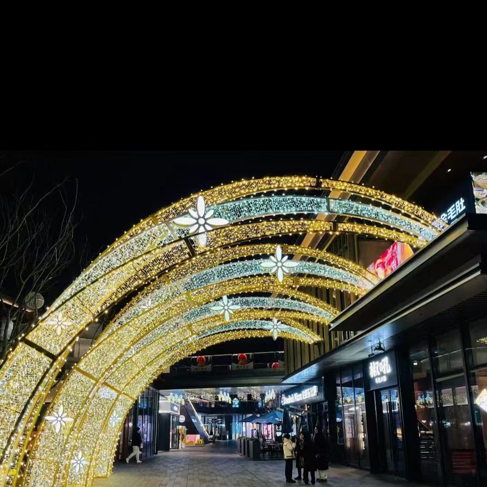 Repeated floral light arcs sweeping over a retail lane with alternating warm white and white bands