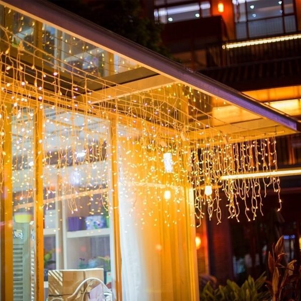 Warm white icicle strands arranged around a decorative entrance framework