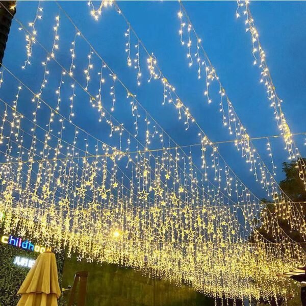 Warm icicle lighting arranged above a pedestrian promenade