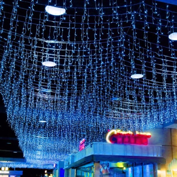 Cool blue icicle lighting suspended over an exhibition-style display area