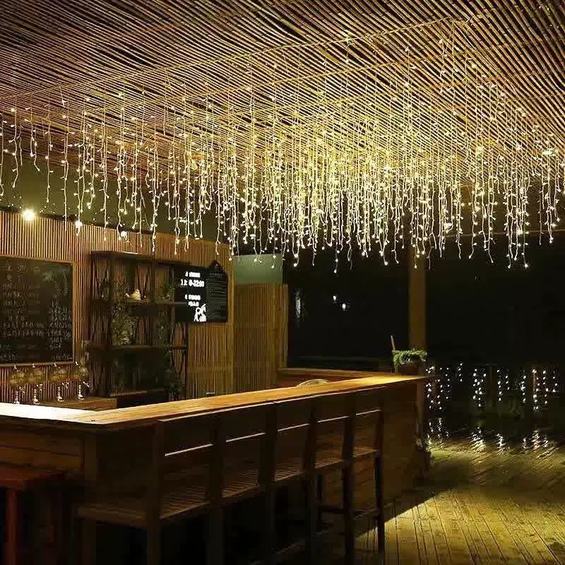 Warm white icicle LEDs decorating a hospitality seating area