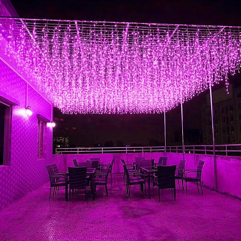 Icicle lighting displayed in a saturated purple-toned decorative scene